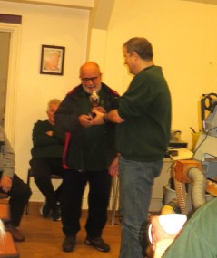 Nick Caruana being presented with the orchard trophy by Paul Hunt